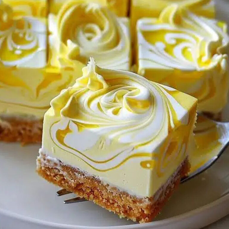 Close-up of lemon marbled cheesecake bars with creamy swirl topping