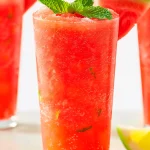 Enjoy a refreshing Summertime Watermelon Bliss Slush, the perfect summer treat. Quick and easy recipe for a cooling delight on hot days!