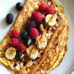 Sweet Banana Oat Omelet with Berries & Peanut Butter