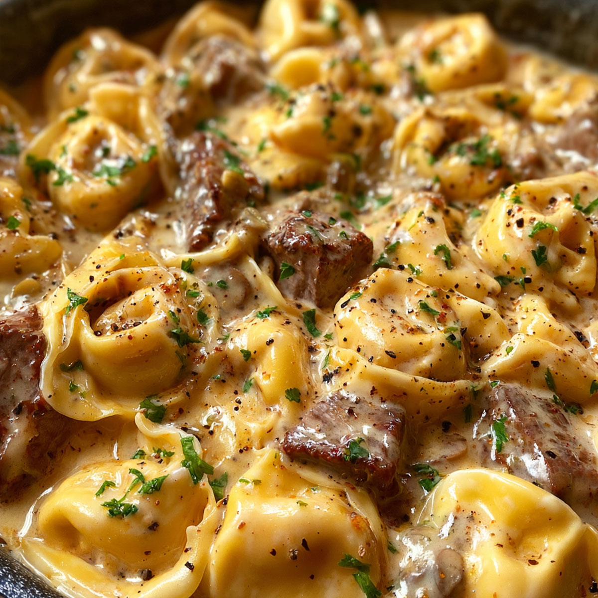 : Creamy Beef Tortellini cooked with herbs and Parmesan cheese