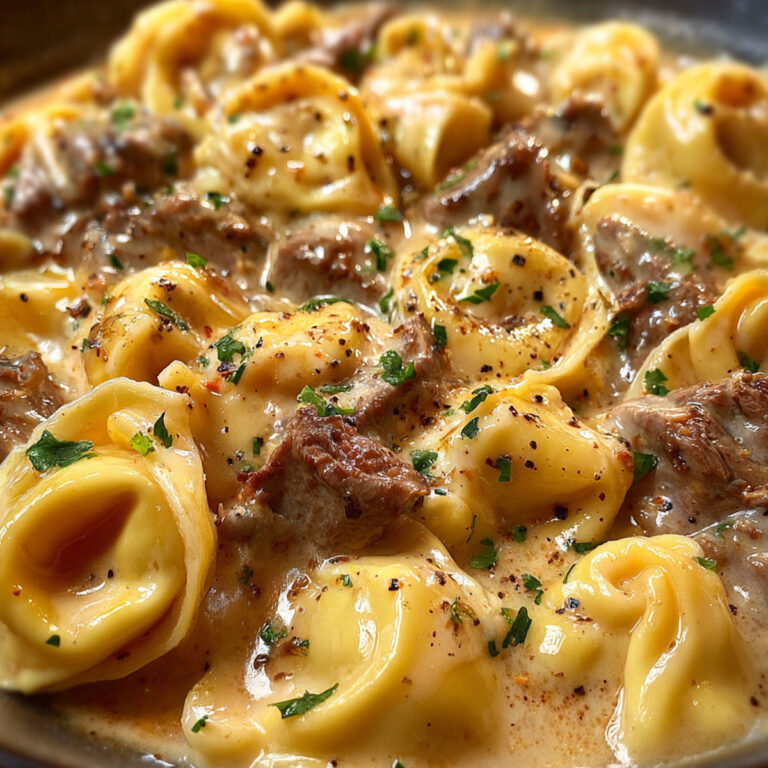 Beef Parmesan Tortellini with fresh herbs and cream sauce