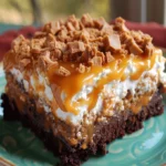 Butterfinger Candy Bar Poke Cake - Irresistible Dessert