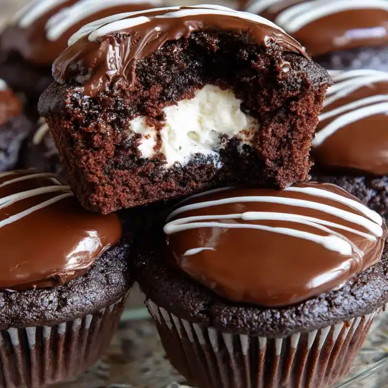Chocolate cupcakes with cream filling and swirl design on top, inspired by Hostess snacks
