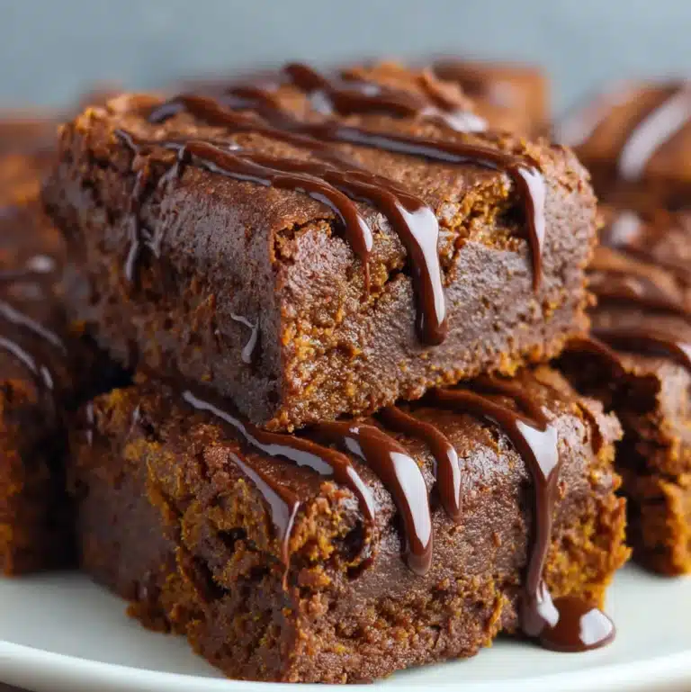 Homemade gluten-free sweet potato brownies stacked on a plate