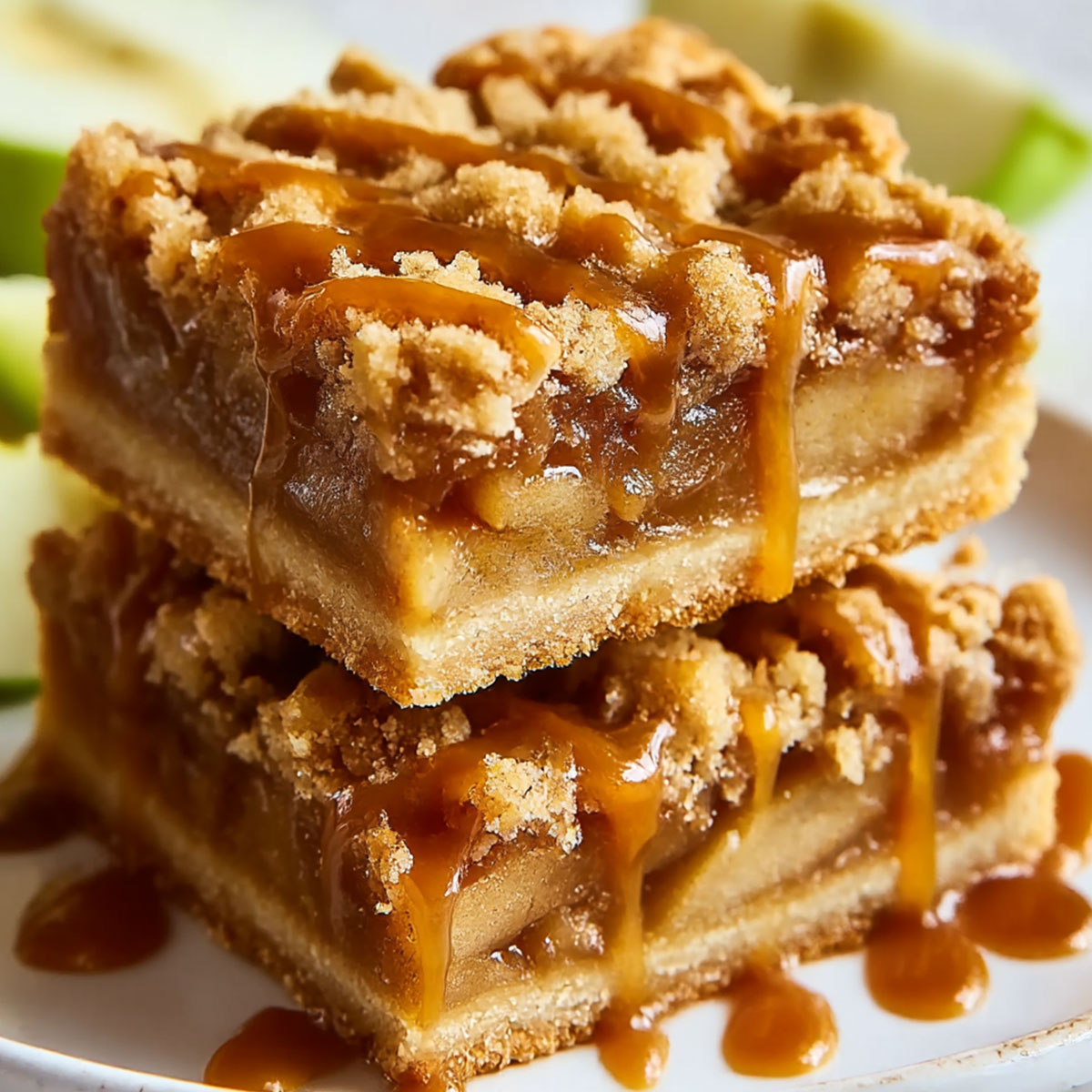 Salted Caramel Apple Pie Bars showing layers of shortbread crust, cinnamon apples, streusel, and caramel drizzle