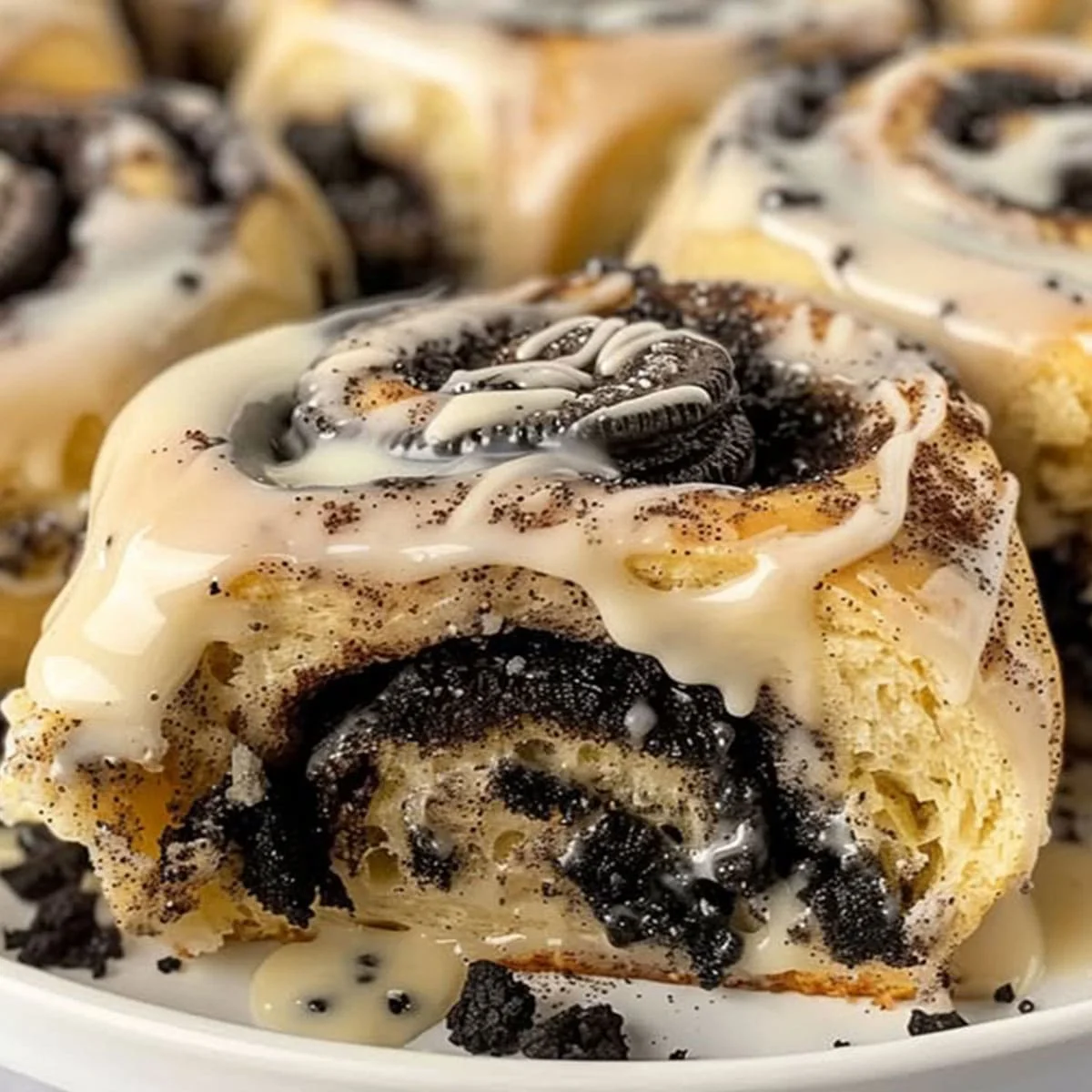 Oreo stuffed cinnamon rolls topped with Oreo cookies and creamy icing